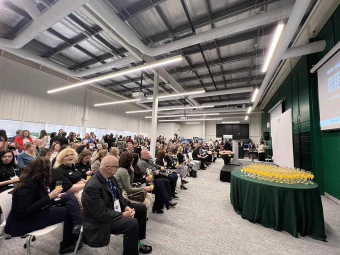 Event attendees gather in DC’s new Centre for Innovation and Research to celebrate the grand opening.