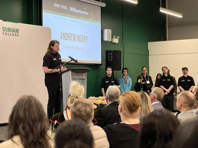 DC journalism student addresses guests at the grand opening of DC’s new Centre for Innovation and Research