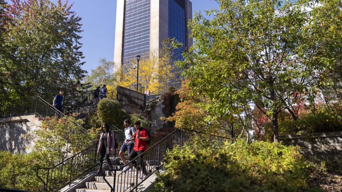 Students walking down an outdoor staircase on the Carleton campus.