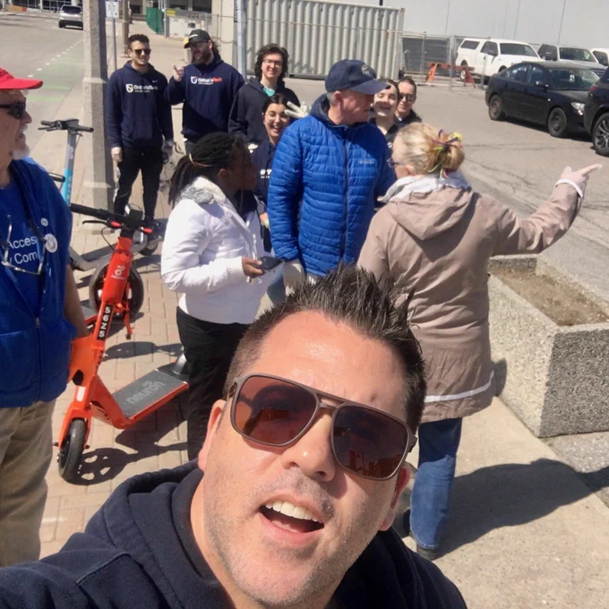 Practicum coordinator Dan Walters takes a selfie with the group from the faculty of social science and humanities behind him as they take part in the community cleanup.