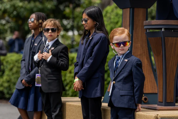 White House staffers' children are dressed as Secret Service agents.