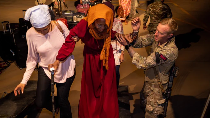Image of UK military personnel, seen here in Sudan evacuating British Nationals onto a RAF flight, bound for Cyprus.  