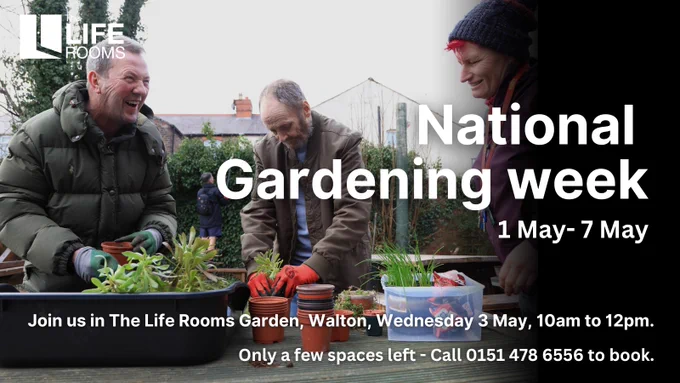 People smiling whilst gardening in our community garden.