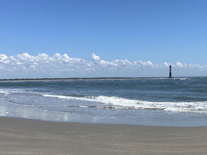 Photo of Morris Island Lighthouse from the north end of Folly Beach, South Carolina.