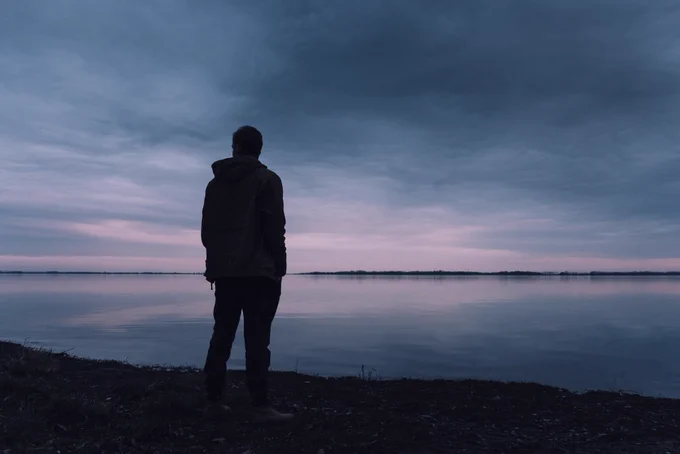 Man looking at sunset