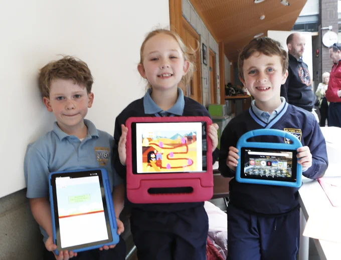 Cillian Flynn(7), Amelia Bray(7) and Oisín Burdett from Milford NS with their game Farm Escape at the Scratch National Finals 2023