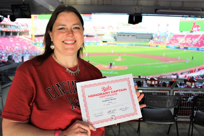 Stephanie Herber poses with her Honorary Captain certificate during the 5/10/23 match-up between the Cincinnati Reds and the New York Mets. Stephanie served as Honorary Captain prior to the game.