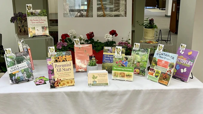 Library display of several gardening books with butterfly bookmarks