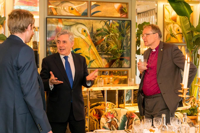 Former Prime Minister Gordon Brown and the Bishop of Durham, the Right Rev. Paul Butler, talk with another person at an event to mark the continuation of the the Warm Welcome project over the summer. 