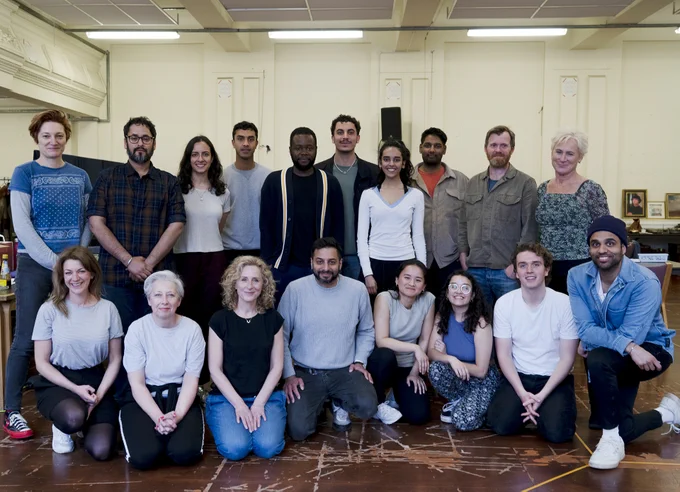 The Empress company in a rehearsal room, standing behind and kneeling in front. 
