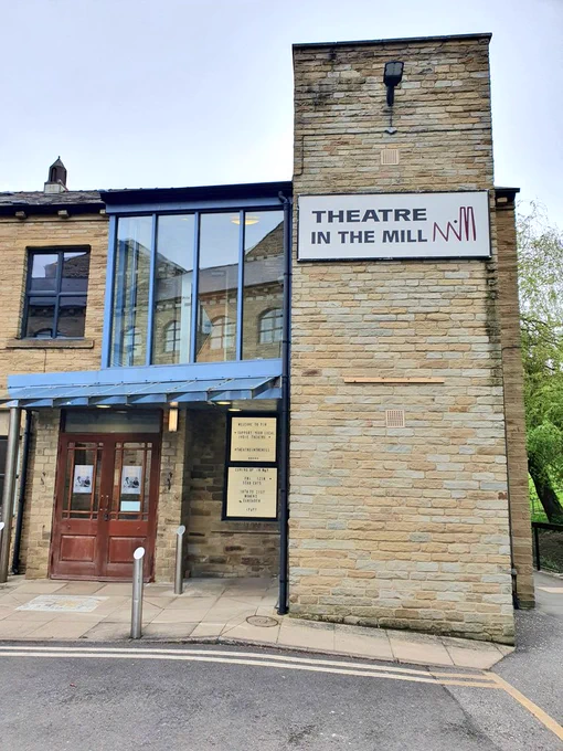 The Theatre in the Mill sign on the outside of the building - Dead Cats show posters can just be seen on both doors.