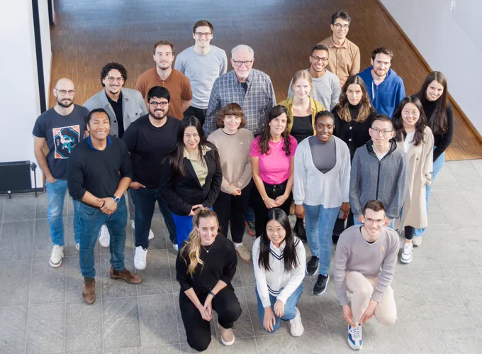 A group picture with 20 happy participants taken from an elevated position.