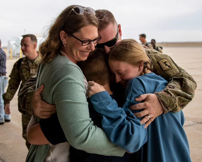 A Soldier is welcomed home.