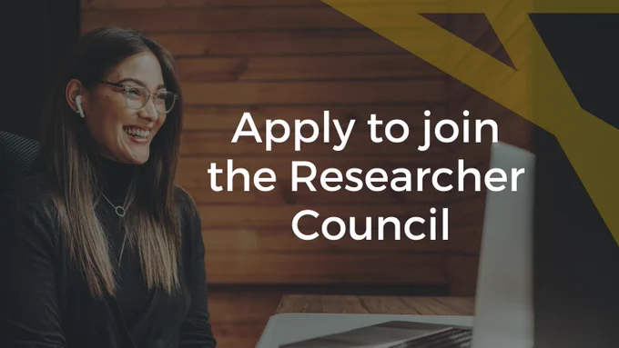 An image of a person sitting at a desk, smiling at a computer with the text "Apply to join the Researcher Council" in white on top.