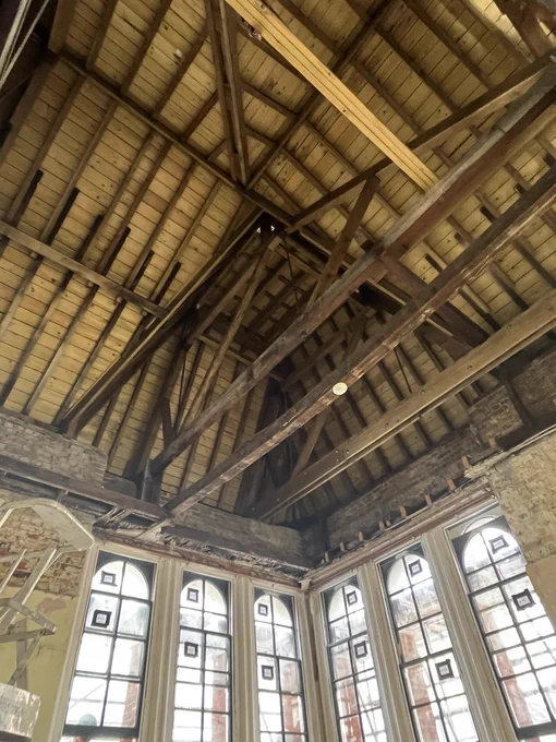 Roof and rafters and arched sash windows