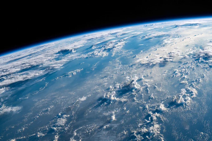 Clouds can be seen in this photo of the earth taken from the International Space Station.	