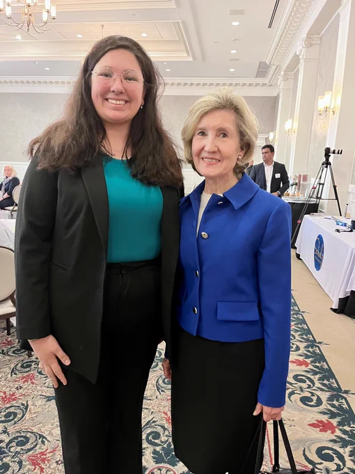 Shelby Lepley (2L) poses for a photo with the International Law Institute keynote speaker, Senator Kay Bailey Hutchison.