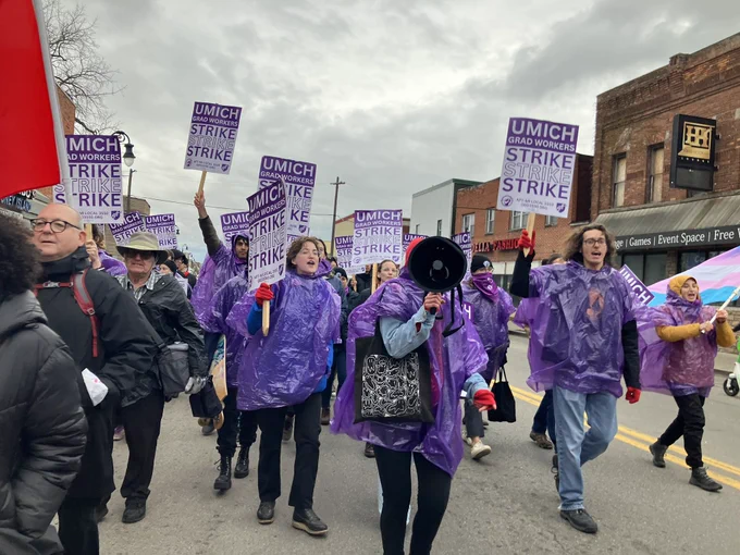 Grad Workers marching in street