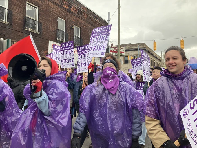 Grad Workers marching in street
