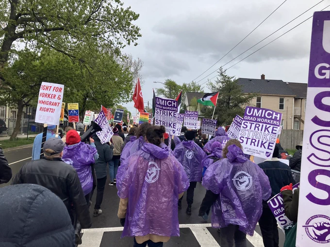 Grad Workers marching in street