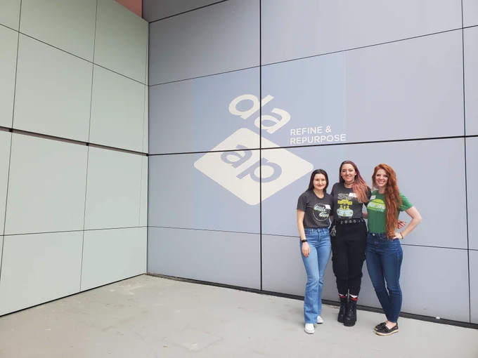 Group photo in front of DAAP sign