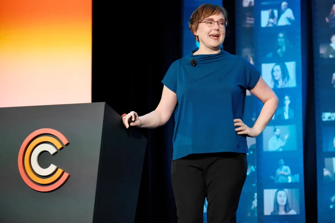 Kristina Halvorson on the main Confab stage standing next to the podium.