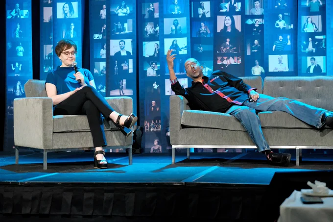 Kristina Halvorson talks with David Dylan Thomas on the Confab stage. David Dylan Thomas kicks back on the couch in content therapy.