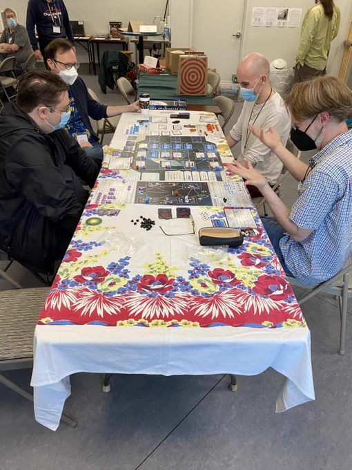 4 people playing a board game