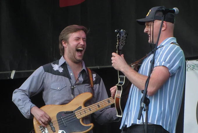 Bass player and mandolin player from Jig Jam perform at Milwaukee Irish Fest 2022.