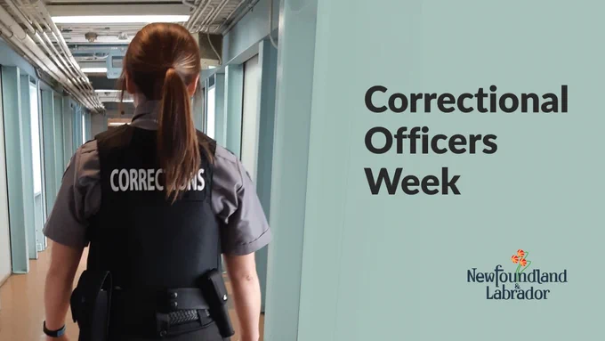 A female corrections officers is stood back on in a hallway. Text reads 'Correctional Officers Week'