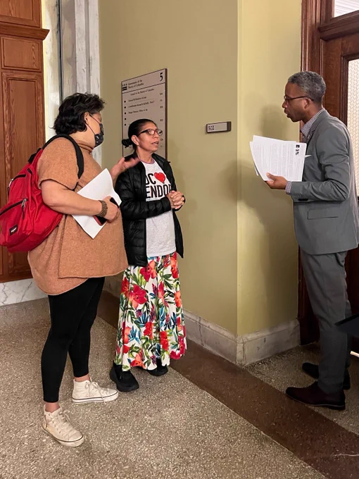 two people talking to councilmember mcduffie