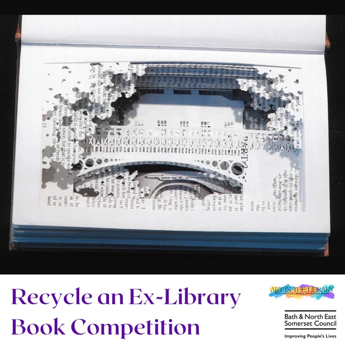 photograph of an open book with the pages carved with a bridge and some leaves