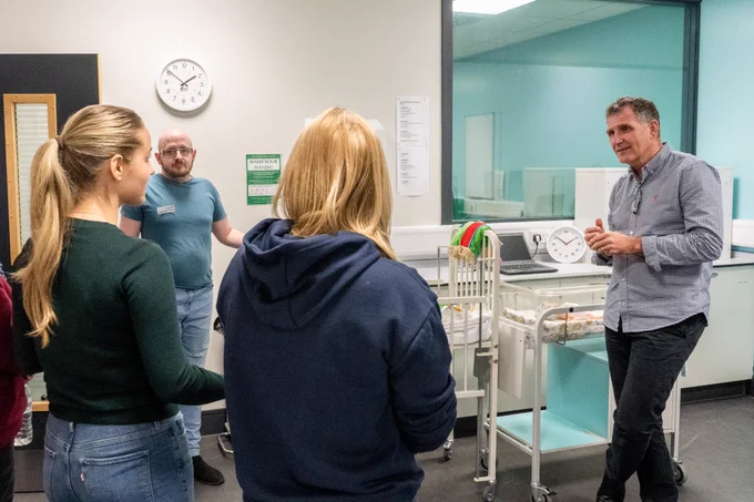 Professor John McKendrick with staff and students in the Simulation & Clinical Skills Centre.