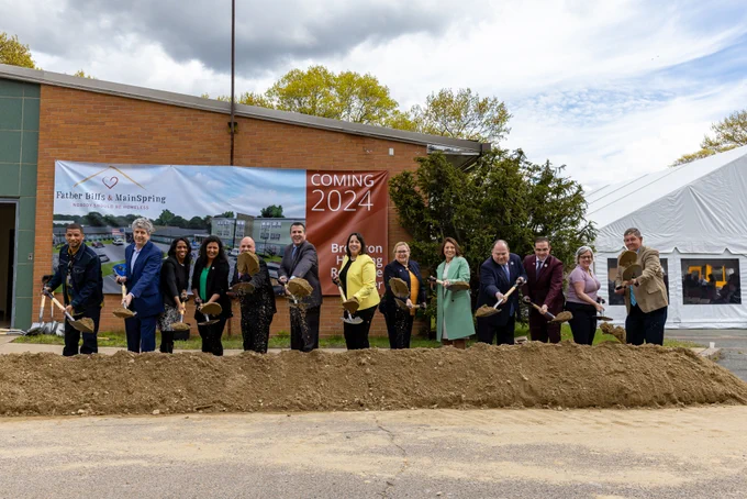 LG Driscoll tossing a shovel-full of dirt at groundbreaking. 