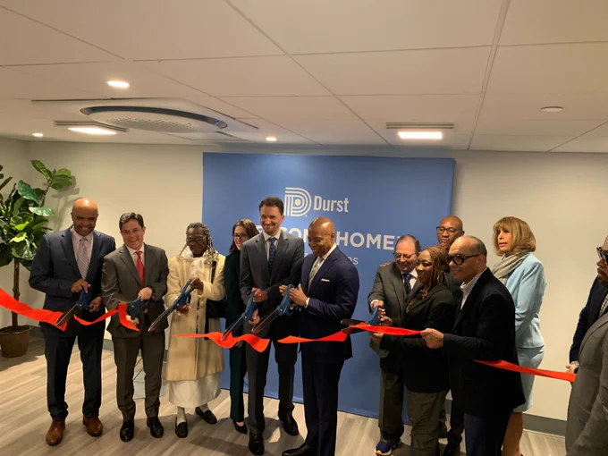Ribbon cutting for 3-24 27th Avenue in Astoria, officially opening the 100% affordable building. NYC Mayor Eric Adams (center), Queens Borough President Donovan Richards (center right), Department of City Planning Director Dan Garodnick (second from left), and Department of Housing Preservation and Development Commissioner Adolfo Carrión Jr. (left), among many others, were in attendance. 