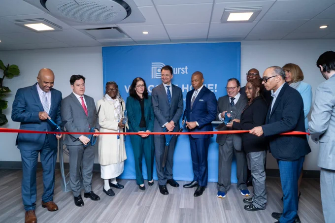 mayor and other city officials help cut red ribbon