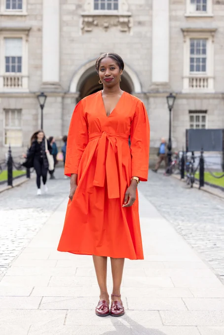 Photo of Victoria Adukwei Bulley standing in Front Square in Trinity College Dublin.