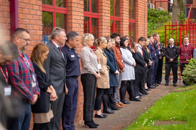 Staff observing a minutes silence