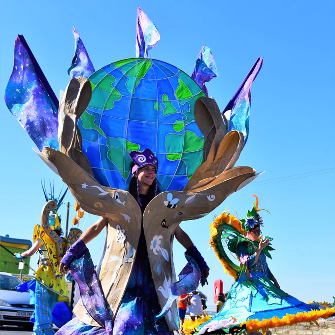 Joel Lines wearing ‘Our world our future’ Costume at IW Mardi Gras. Photo credit: Tracy Curtis