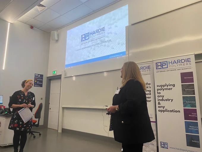 Photo of Isy Ferguson from Hardie Polymers (event sponsor) being welcomed by Dr Jenni Garden to the ScotCHEM Polymer & Soft Materials II Conference.