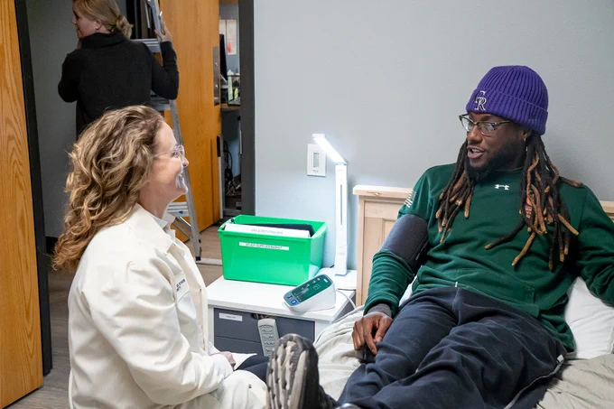 Dr. Josiane Broussard with a participant of a study in the Sleep and Metabolism Lab at CSU.