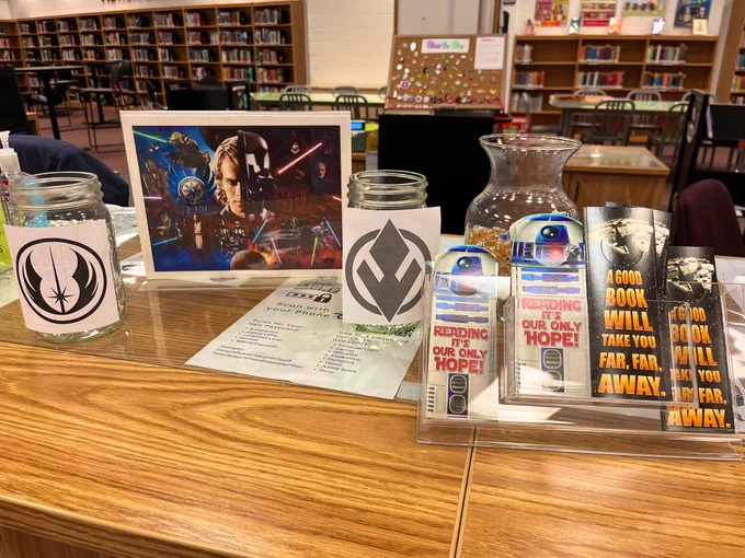 Voting display for Jedi versus Sith. Star Wars Bookmarks that say “Reading it’s our only hope!” And “A good book will take you far far away”