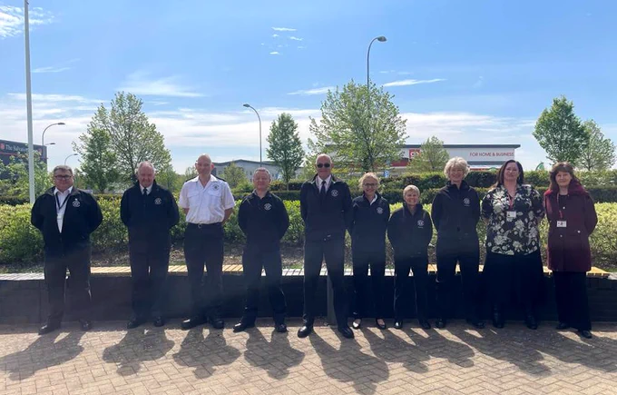 Members of our Prevention and Protection teams standing in line outside.