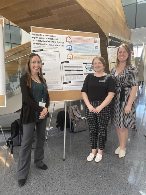 Jessica, Lindsey, and Emily standing next to research day poster