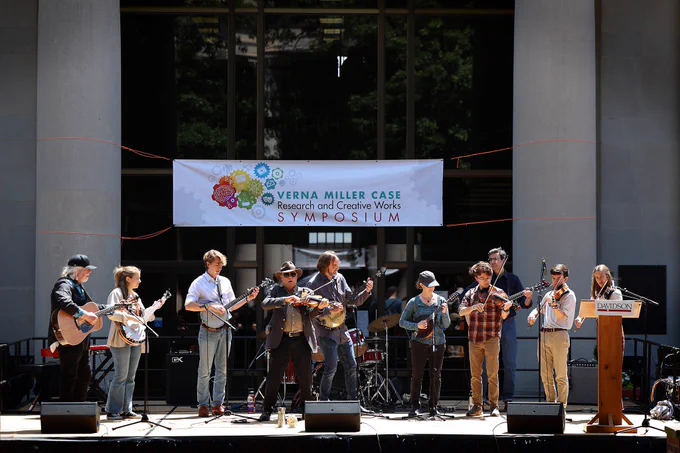 A musical performance in front of E. H. Little Library.