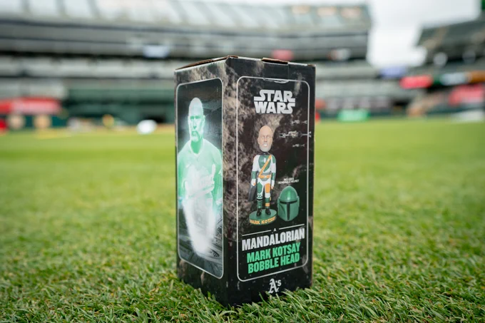 Mark Kotsay Mandalorian Bobblehead in box on the field.