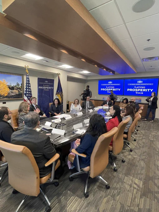Fifteen people and three people standing indoors.