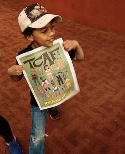 Jackson hold up his TCAF reading material