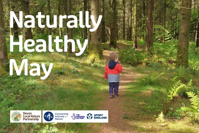 A child walking on a trail in the woods. Text reads: “Naturally Healthy May”. 
