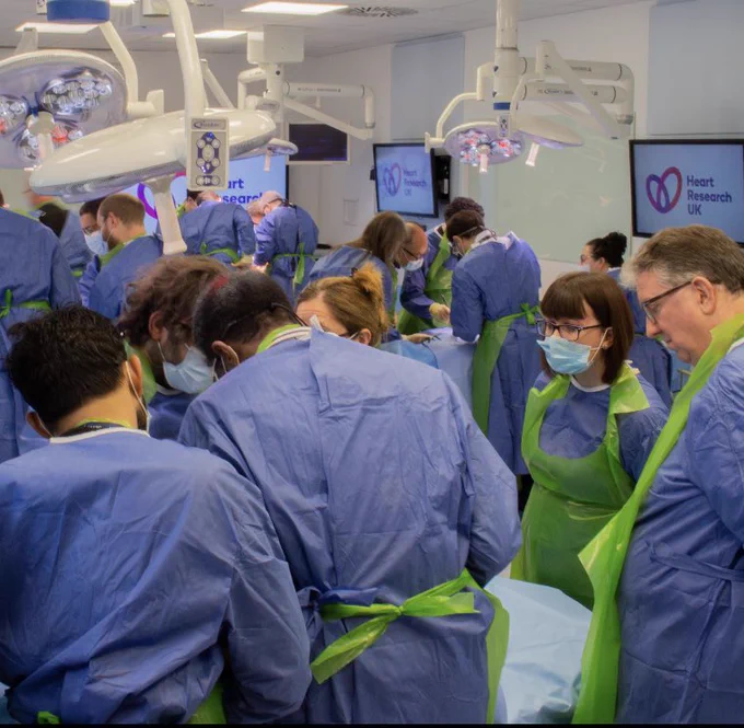 Surgical training suite with active surgical training taking place (no cadaveric specimens shown)